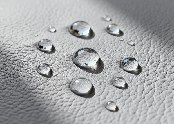 Water droplets resting on microfiber leather surface Water droplets resting on microfiber leather surface